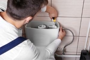 repairing toilet