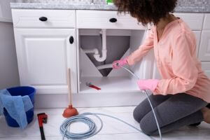 Homeowner Trying to Fix a Clogged Sink