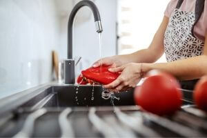 Water Pouring From Kitchen Faucet